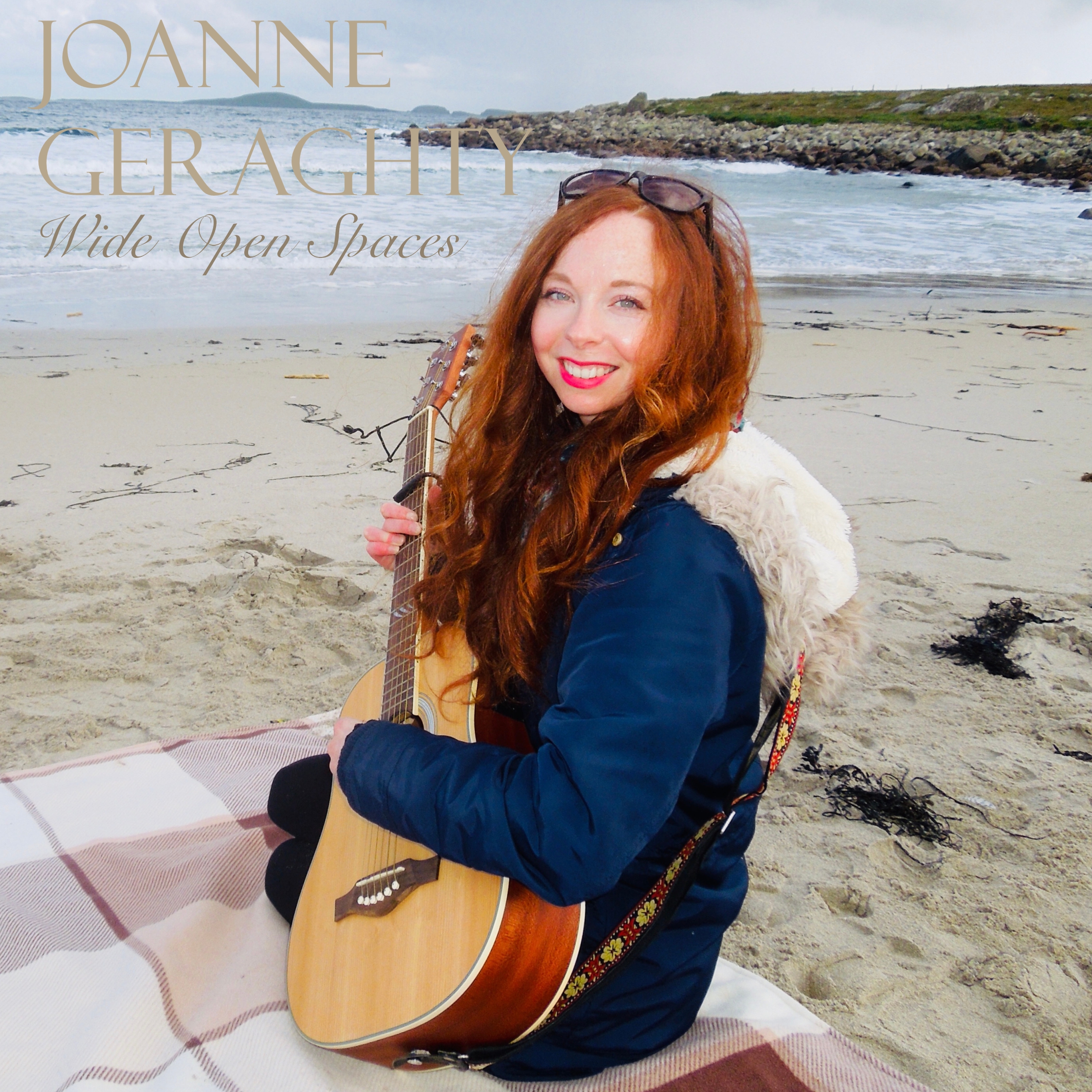 Wide open spaces cover picture - Jo playing guitar on the beach